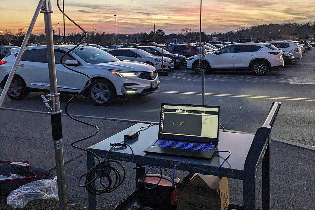 'laptop on mobile tray in RIT parking lot for field research'